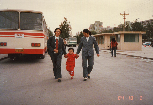 1980S Beijing, CHINA. The little girl’s mother and aunt with for her to walk down the streets of Beijing. Reflects the real life of the 80s Berijing.
