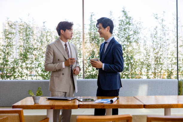 istock Two Asian businessmen are talking 1345243182