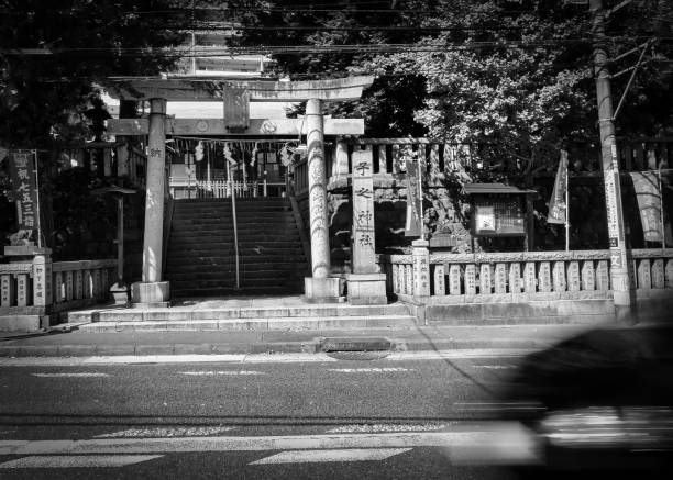 Yokosuka, Kanagawa Prefecture, Japan - October 6, 2021: A car passes the Shioiri Neno Shrine.