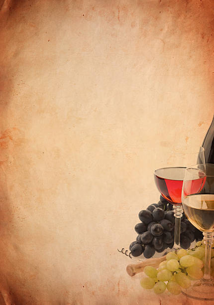 wine in glass and grape fruit on old paper parchment background