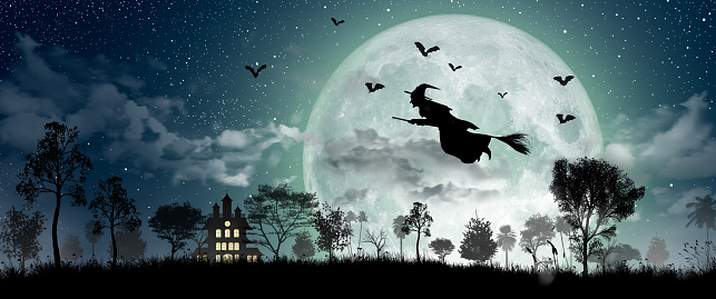 Halloween Silhouette of Witch flying over the full moon, haunted house, bats, and dead tree.