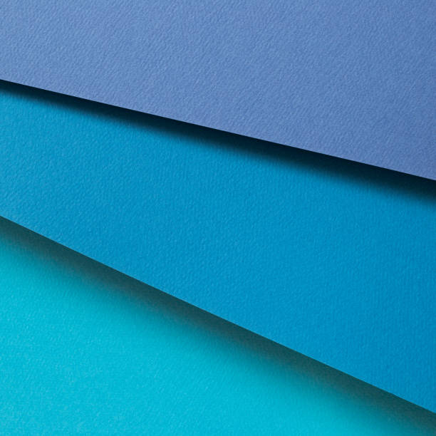 istock Abstract blue layered color paper background 1345253775