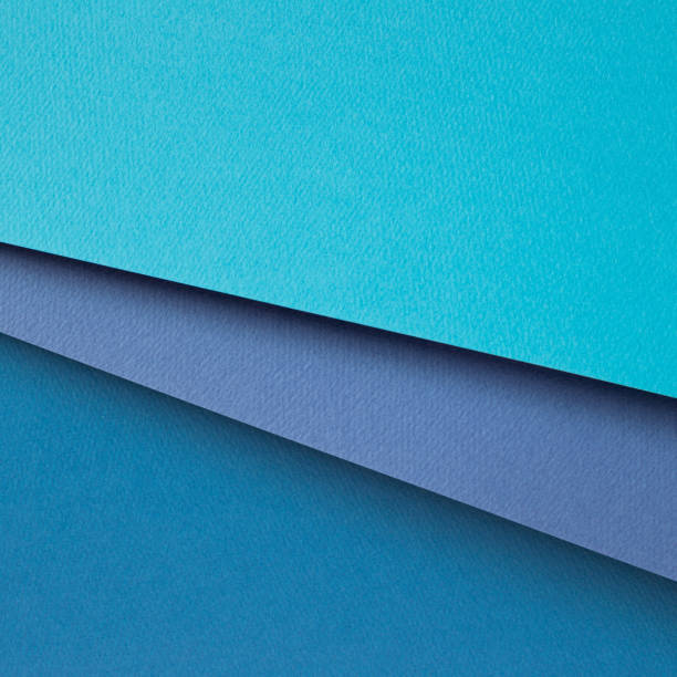 istock Abstract blue layered color paper background 1345253820
