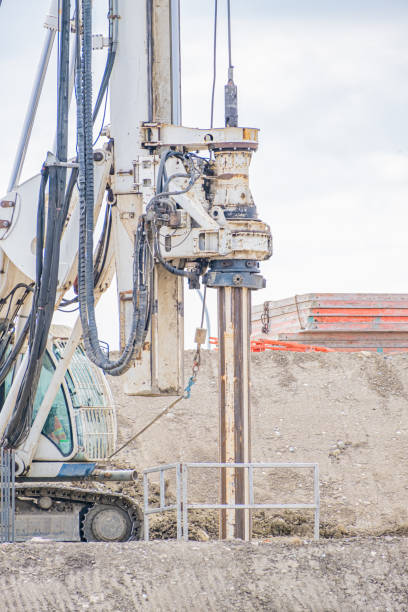 istock Construction Site - Heavy industrial drilling machine at road works 1345253971