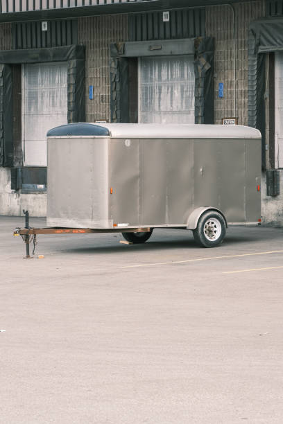 istock Cargo trailer parked in front of factory Loading bay 1345253995