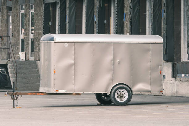 istock Cargo trailer parked in front of factory Loading bay 1345253999