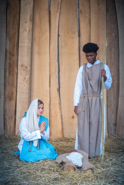 istock Vertical nativity scene with multi-ethnic characters in a crib 1345260367