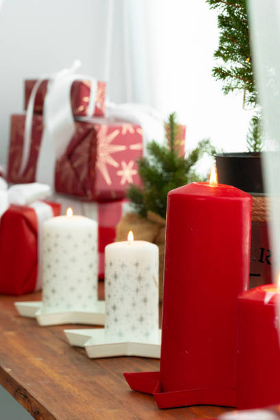 istock Interior decoration with red and white Christmas candles 1345260597