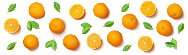istock Fruit pattern arranged of oranges and orange leaves on white background. Lay out background. 1345260686
