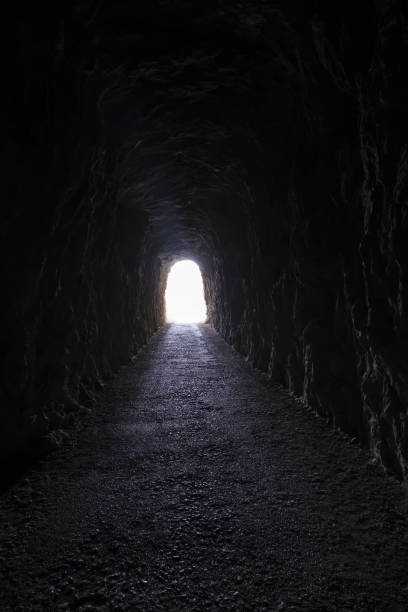 istock Dark tunnel in the stone 1345261571