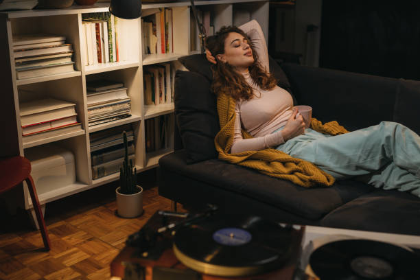 istock woman relaxing at home . evening scene 1345261648
