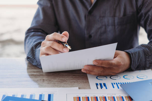 istock strategy analysis concept, Businessman working financial Manager Researching Process accounting calculate analyse market graph data stock information review on the table in office. 1345262654
