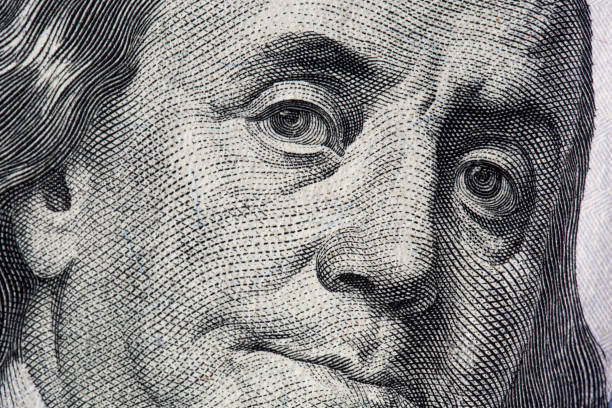 istock Texture of dollar bills. One hundred dollars. Close-up, macro 1345264332