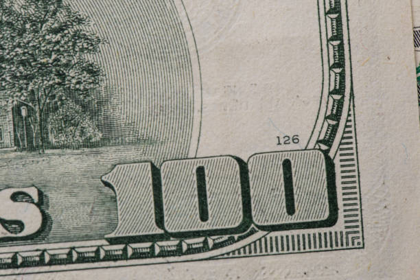 istock Texture of dollar bills. One hundred dollars. Close-up, macro 1345264998