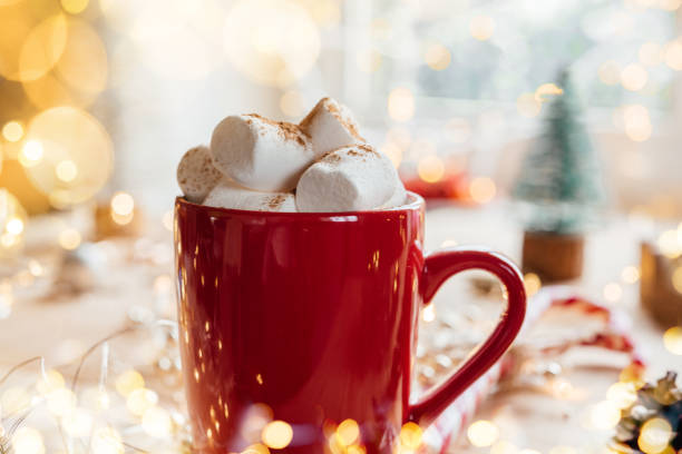 istock Red cup with hot chocolate and marshmallow Christmas atmosphere background 1345266182