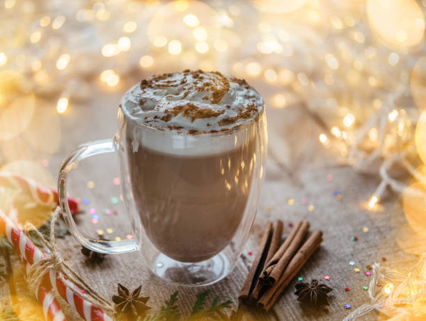 istock Christmas hot chocolate with whipped cream, candy canes, and thuja branches 1345266250