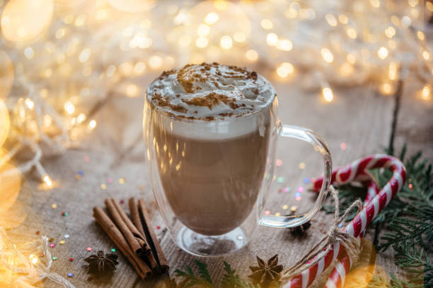 istock Christmas whipped cream hot cocoa with spices, candy canes and thuja branches 1345266337