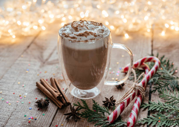 istock Christmas whipped cream hot chocolate with spices, candy canes and thuja branches 1345266387
