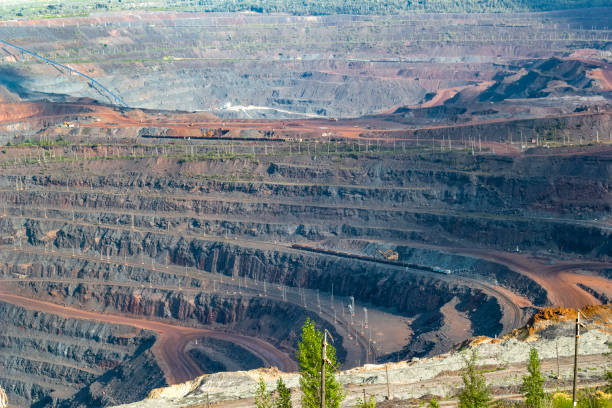 istock Panorama of large operating mine. Extraction of natural resources. 1345266449