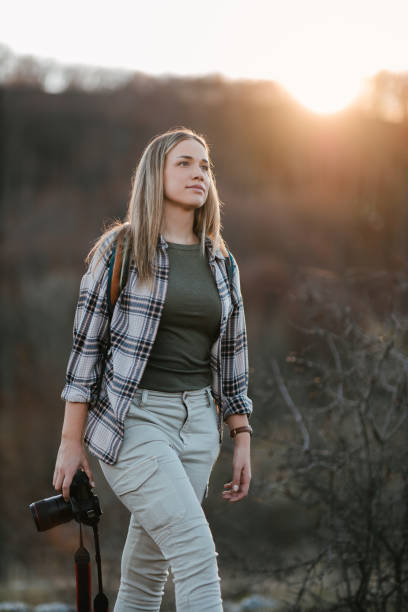 istock Female photographer on the move 1345267268