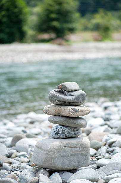 istock Stone tower on the beach and blur background,vertical photo 1345269470