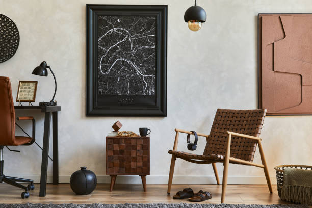 istock Creative composition of elegant masculine home office interior with mock up poster frame, brown armchair, industrial office desk and personal accessories. Template. 1345274803