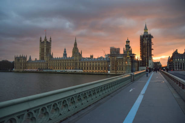 a dramatic sunset over the houses of parliament, london, uk - city of westminster big ben london england whitehall street imagens e fotografias de stock