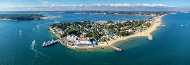 Sandbanks, Poole Harbour, Bournemouth, England, UK Aerial view of Sandbanks and Poole Harbour. Sandbanks is famed for its high property prices and for its award-winning beach. bournemouth england photos stock pictures, royalty-free photos & images