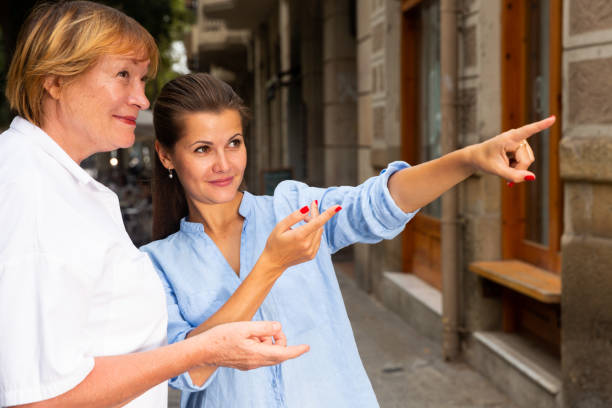 istock Young woman with elderly mother exploring city sights 1345281269