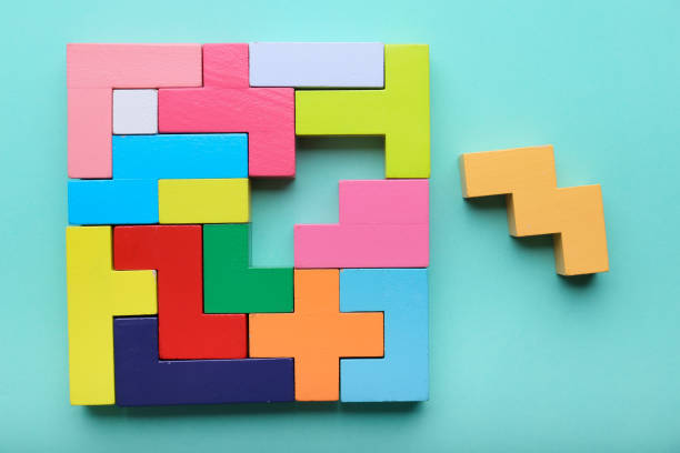 istock Multicolored puzzle, cubes on a blue background top view 1345282218
