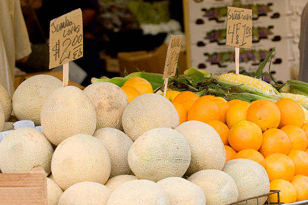 Melons, Oranges, et maïs doux à Farmers Market - Photo