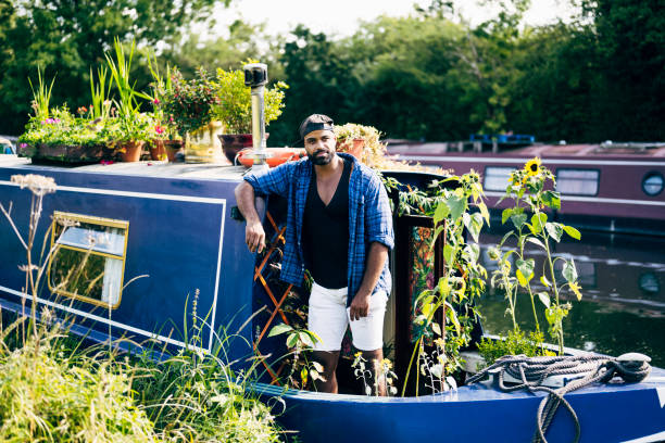 istock British man enjoying simple living onboard floating home 1345283199