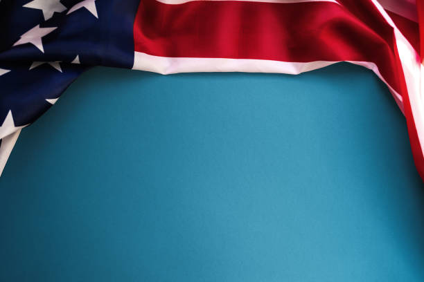 istock Veterans Day and Independence Day. Blue background with an American flag. Flat lay. Copy space. The concept of American's national holidays 1345283638