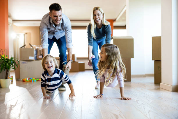istock Wheelbarrow race at new apartment! 1345284395