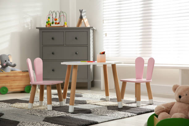 istock Little table and chairs with bunny ears in children's room. Interior design 1345284833
