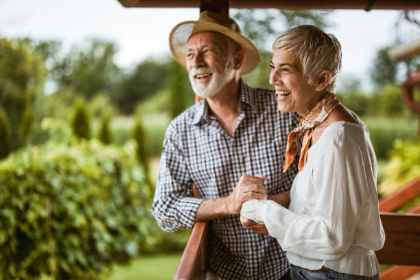 istock Happy mature couple enjoying on a terrace. 1345284843