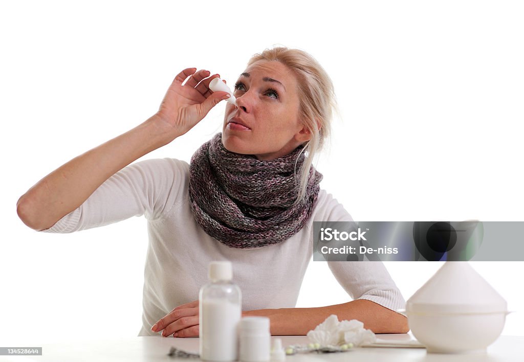 Sick young woman Portrait of a cold young woman  at the table Adult Stock Photo