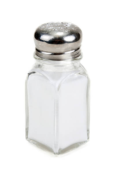 istock Glass salt shaker filled with salt on a white background 134528715