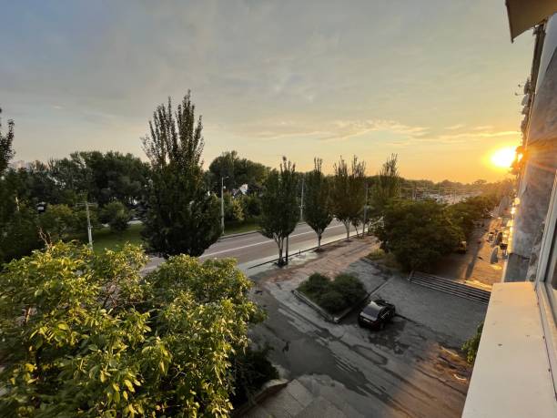 istock sunset over the city, view from window 1345288452