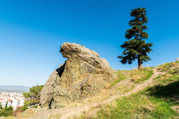 Niobe Weeping Rock (Aglayan Kaya), a natural rock formation, in Manisa, Turkey. According to Greek mythology, the Greek deities Apollo and Artemis killed all 14 children of Niobe at Mount Sipylus, whereupon the grief-stricken Niobe was turned to stone.