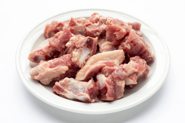 istock Raw pork ribs in white plate on white background. 1345291368