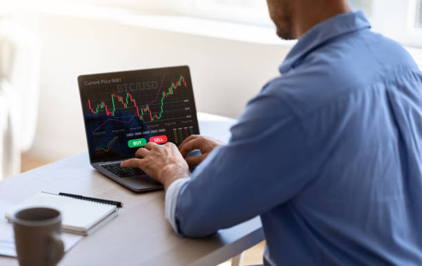 istock Unrecognizable black businessman working on laptop in office, trading online 1345291909
