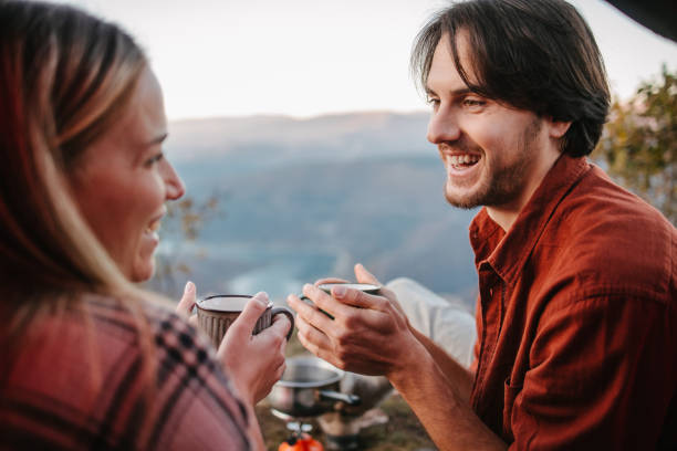istock Campers holding cups of soup 1345294196