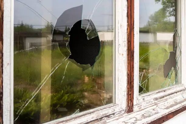 Photo of Broken window pane after a break-in