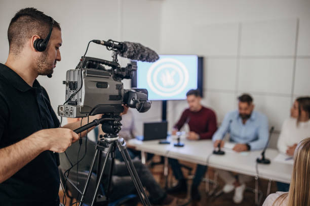 istock Cameraman recording press conference 1345296016