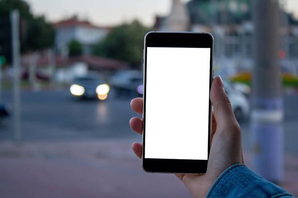istock Woman using black smartphone at the outdoors. 1345296599