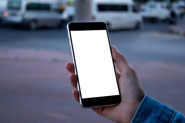 istock Woman using black smartphone at the outdoors. 1345296618