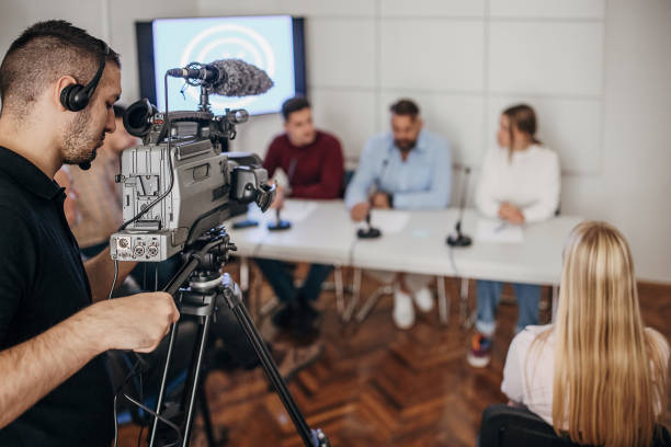 istock Cameraman recording press conference 1345296958