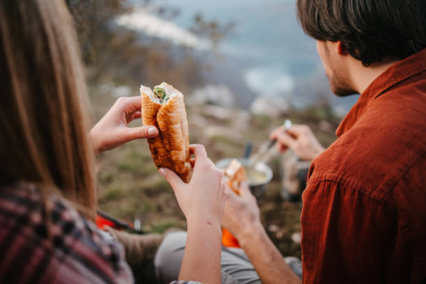 istock Two campers eating sandwiches 1345297141