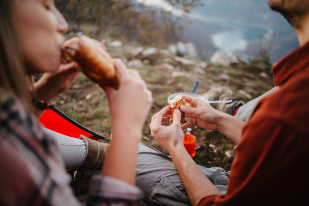 istock Two campers eating sandwiches 1345297888